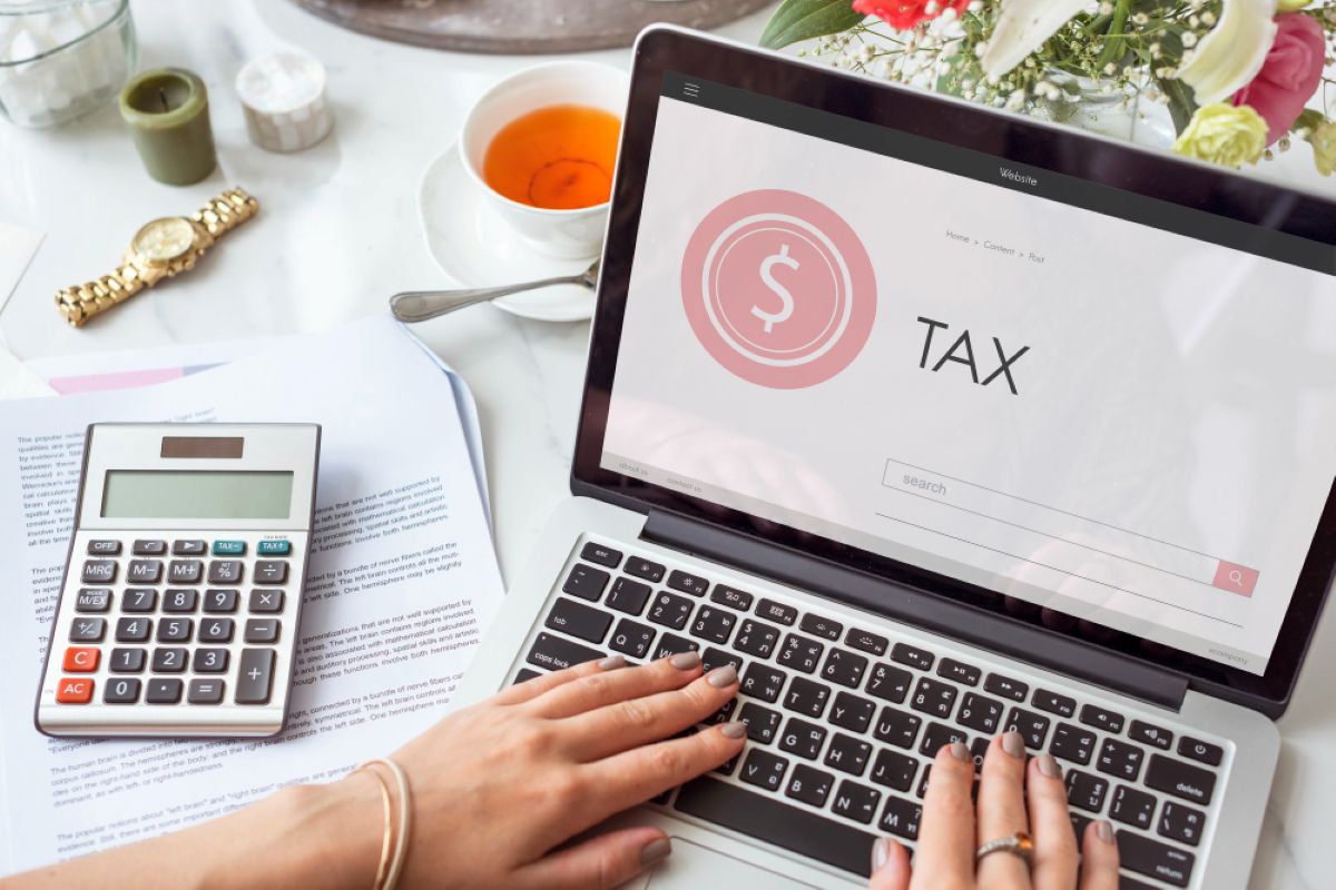 "Risians Accounting expert tax agent in Dubai analyzing financial records for VAT and corporate tax solutions."